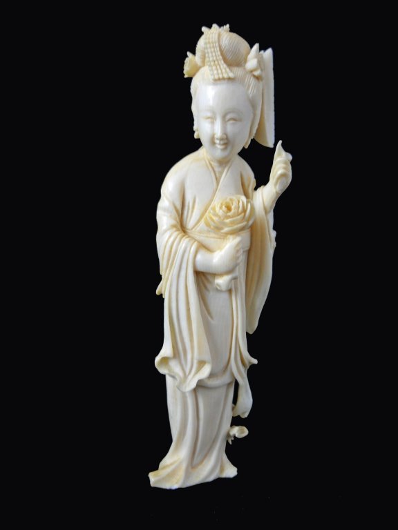 Hand Carved Ivory Netsuke Figure: Hand Carved Ivory Netsuke Figure measures 5 inches tall
