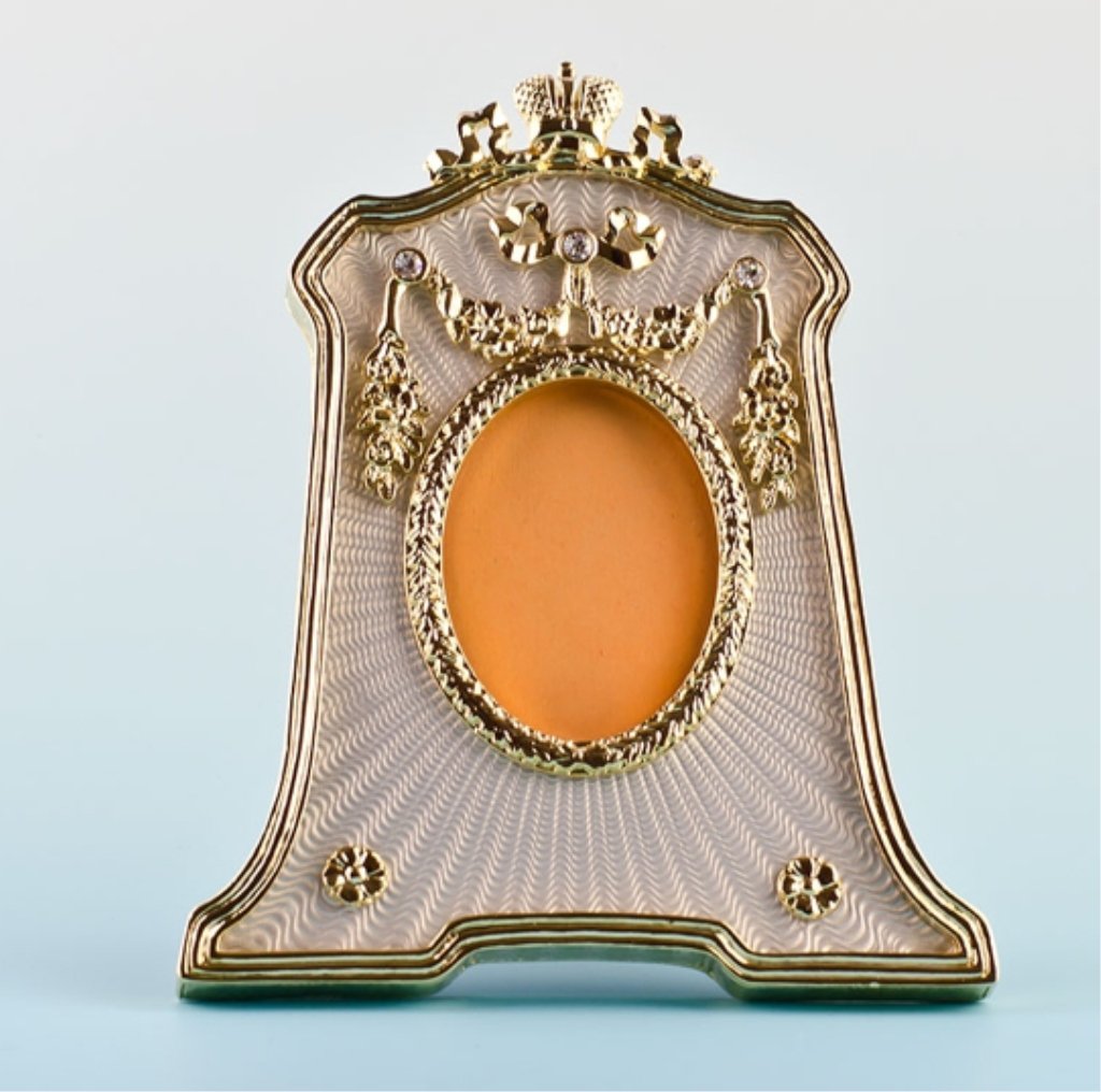 Silver Enameled Faberge Inspired Picture Frame: Silver Enameled Faberge Picture Frame This silver guilloche enameled photo frame contains golden garlands suspended from elegant crystals, the top of which is a ribbon cresting. This is a replica of f