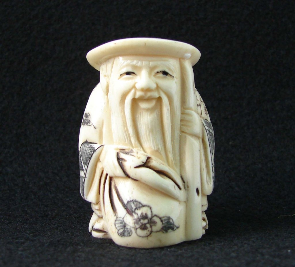 Hand Carved Ivory Netsuke Figure: Hand Carved Ivory Netsuke Figure measures approx 2 inches tall