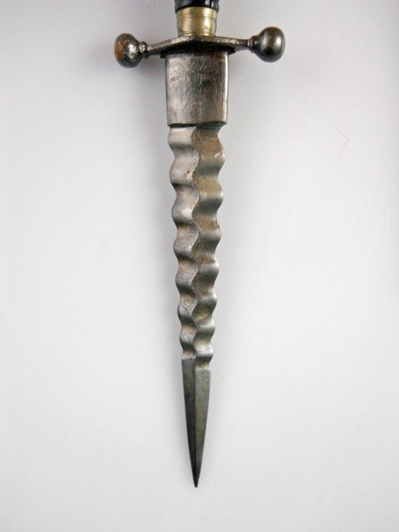 Late 17th early 18th century dagger: Italian Ebony gripped armor piercing, late 17th early 18th century dagger with cannon ball quillion, in excellent order with original scabbard. Fine to excellent overall condition. Blade 5in Total 9 1