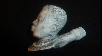 Clay Pipe depicting the head of Southern Slave: Early Clay Pipe depicting the head of Southern Slave during the 1840 to 1860 period. This pipe was unearthed at a tavern site in South Carolina and were most probably cast in the south and given to bi