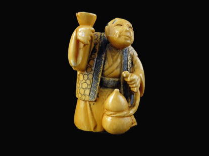 Signed Hand Carved Ivory Netsuke Figure: Signed Hand Carved Ivory Netsuke Figure measures 2 inches tall