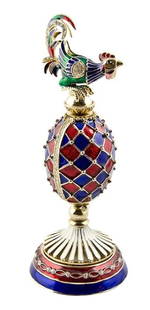 Faberge Inspired Rooster Egg: Faberge Inspired Rooster Egg Features: ¥6.5'' (H) X 2.5'' (Base Diameter) 1.75" (Egg Diameter) ¥Pewter, Crystals, Enamel The Faberge Inspired Rooster egg is painted in deep blue and red color and