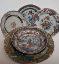 A Cantonese plate Collection: A Cantonese plate decorated with courtiers on a terrace, diameter 83.5cm, (damage), together with three plates and one other