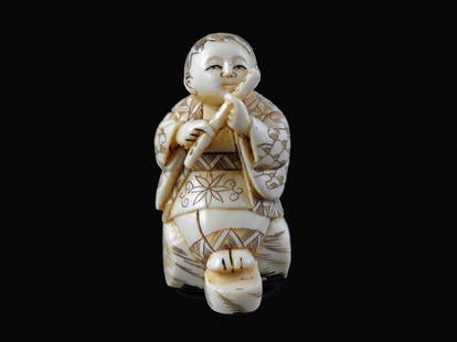 Signed Hand Carved Ivory Netsuke Figure: Signed Hand Carved Ivory Netsuke Figure measures 2 inches tall