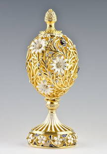 Resting Butterfly Faberge Inspired Egg: Resting Butterfly Faberge Inspired Egg ¥ 6.5'' (h) X 2.25'' (d) ¥ 1 Lbs 12 Oz ¥ Pewter, Crystals, Enamel Submerged In A Beautiful Flower Garden, This Faberge Egg Uncovers An Exquisite,
