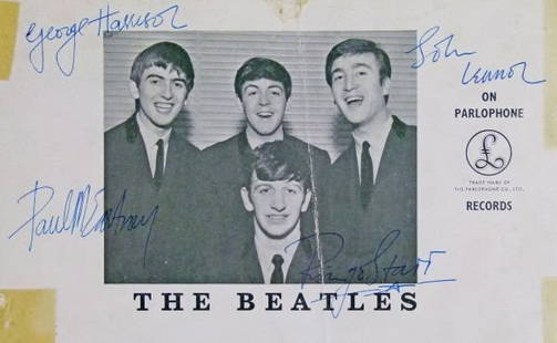 Original Beatles Autographs - 1963: Extraordinary Rare and Early Autographs - The Beatles - A 1963 Parlaphone promotional photo card signed by John Lennon, Paul McCartney, George Harrison and Ringo Starr, overall size 12.5cm x 20cm