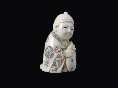 Hand Carved Ivory Netsuke Figure: Hand Carved Ivory Netsuke Figure measures 1 1/2 inches tall