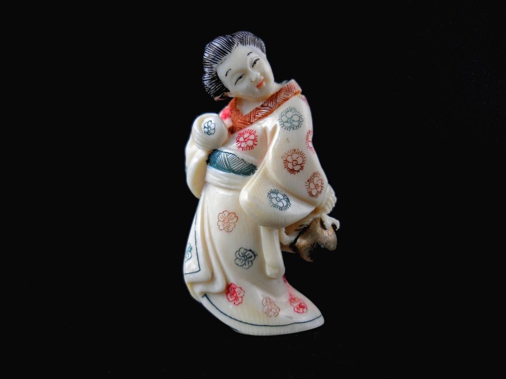 Signed Hand Carved Ivory Female Netsuke: Signed Hand Carved Ivory Female Netsuke measures 2 inches tall
