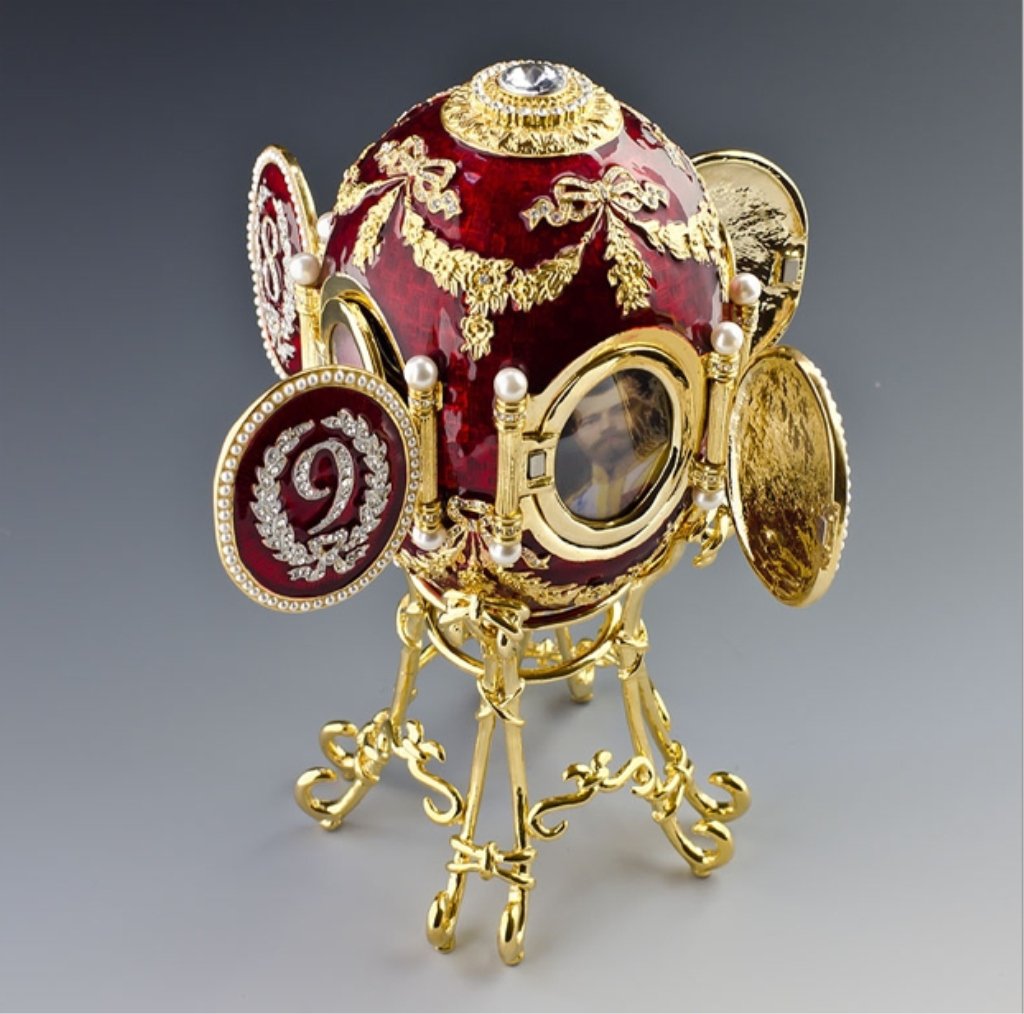 Faberge Inspired Egg: Egg + Stand Dimensions: 6.5 '' (H) Egg Dimensions: 4" (H) x 2.75" (D) Material: Pewter, Crystals, Enamel The first of Imperial Easter eggs known to be dated. Made by M. Perchin under the Faberge super