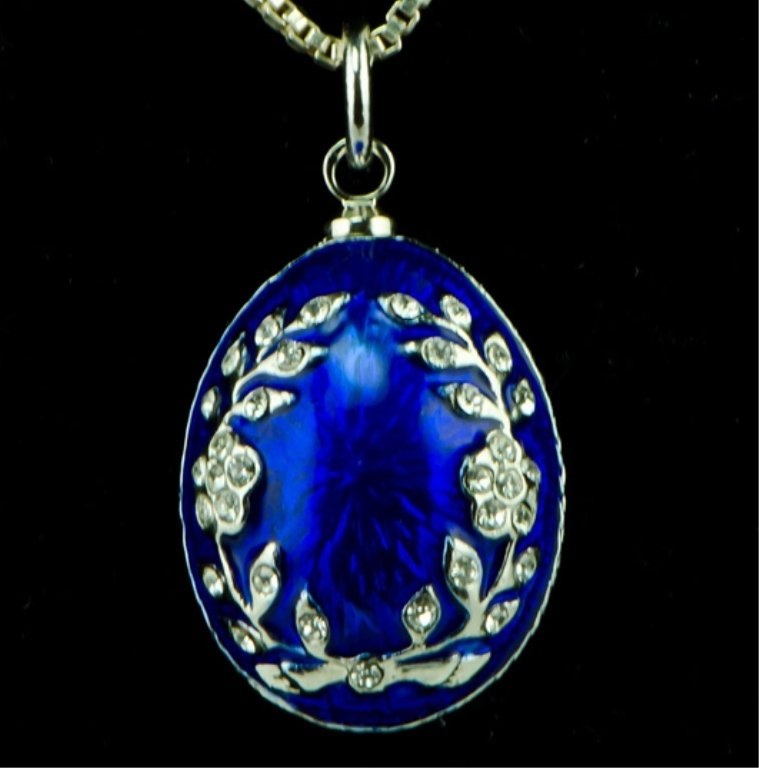 Ivy Faberge Inspired Egg Pendant: Elegant and grandiose, this Faberge inspired egg pendant is ready to add the extra something to complete the look of an outfit! Features: 0.75" (H) x 0.5" (D) 68 Austrian Crystals, Pewter, Enamel , Ch