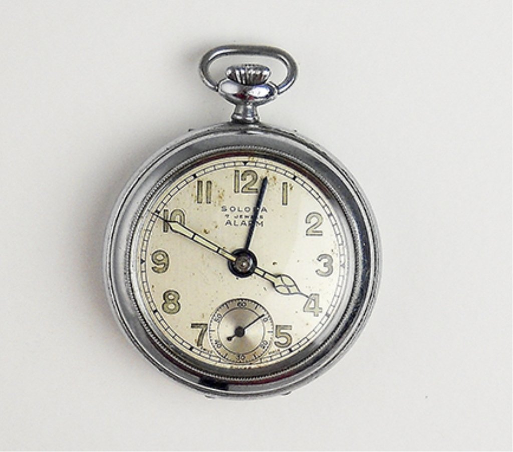 Men's Old Solora Alarm Pocket Watch: Men's Old Solora Alarm Pocket Watch. The Watch Looks Like It Has A Silver Case. The Face Is White With White Numbers Outlined In Black. It Is Sold As Is.