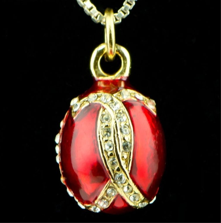 Venezia Faberge Inspired Egg Pendant: Elegant and grandiose, this Faberge inspired egg pendant is ready to add the extra something to complete the look of an outfit! Features: 0.75" (H) x 0.5" (D) 57 Austrian Crystals, Pewter, Enamel , Ch