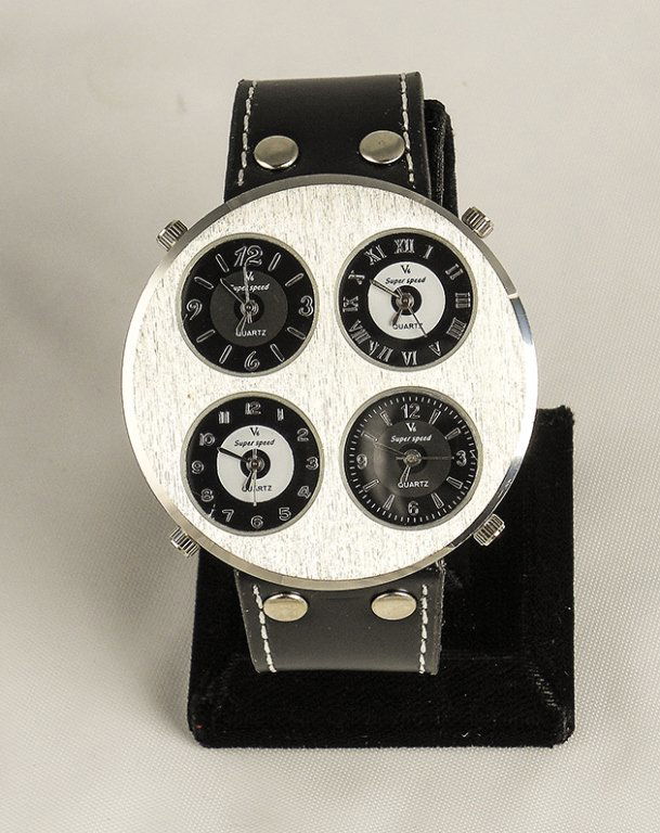 Oversized Men's Sports Watch: Oversized Men's Sports Watch. Watch Has An Analog Display With 4 Time Zones. The Band Is Heavy Duty Black Leather With A Brushed Stainless Steel Face. The Watch Has A Quartz Movement.