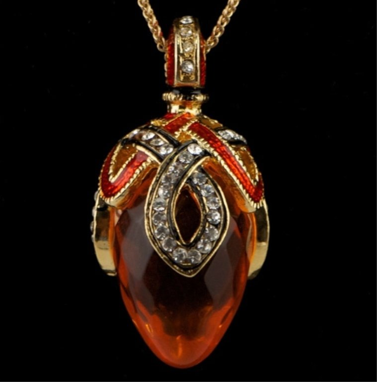 Crystal Loop Faberge Inspired Pendant: Elegant and grandiose, this Faberge inspired egg pendant is ready to add the extra something to complete the look of an outfit! Features: 1.5" (H) x 0.5" (D) 84 Austrian Crystals, Pewter, Enamel , Cha