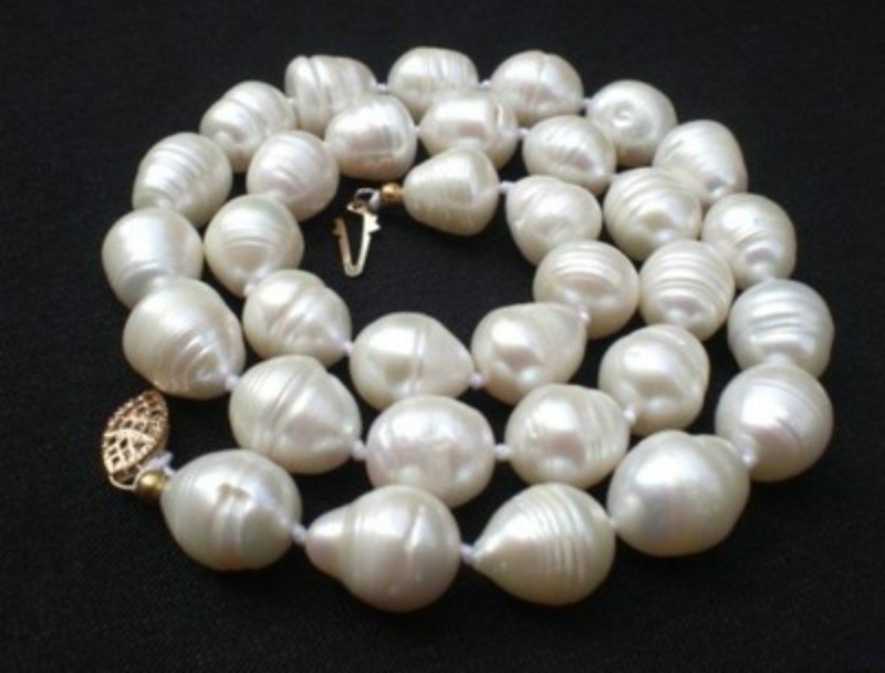 Tahitian White Baroque Pearl Necklace: Tahitian White Baroque Pearl Necklace, pearls measure approx 11-13mm. necklace measures approx 18 inches, 14kg clasp.