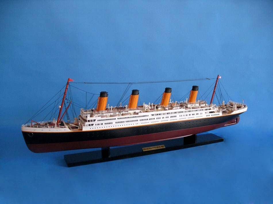 RMS Titanic 40" Model Ship: RMS Titanic 40" Model Ship. High quality woods include cherry, birch, maple and rosewood. Painted lifeboats with detailed launching davits. Interior windows and doors visible through promenade decks.
