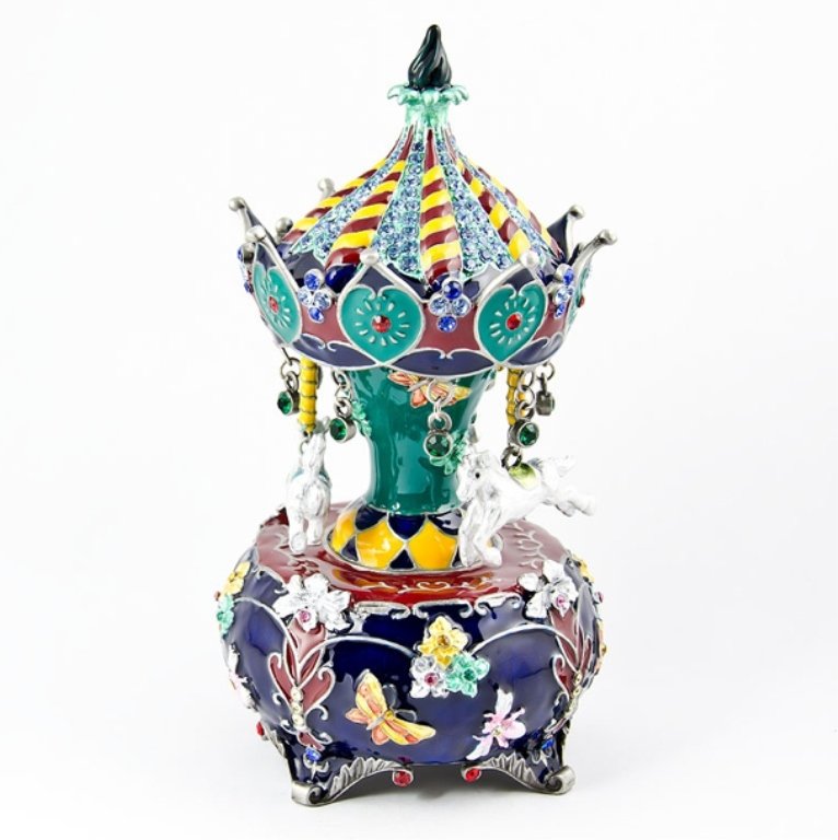 Faberge Inspired Carousel Figurine: Exceptional variety of colors and technique were used to create this figurine. Using an guiloche enamel, this figurine includes blue, green, yellow, maroon, and white colors. The bottom of the carouse
