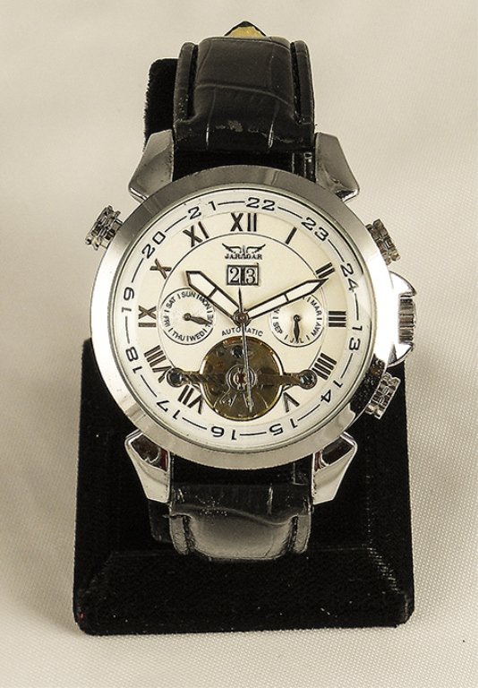 Men's Elegant Tourbillon Watch: Men's Elegant Tourbillion Watch. Watch Has An Analog Display In Roman Numerals Featured In Stainless Steel. The Band Is Black Leather With A Stainless Steel Face. The Watch Has An Self Wind Mechanical