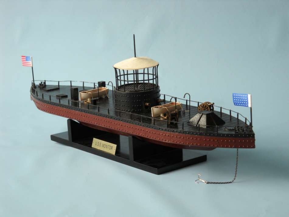 USS Monitor Limited 21" Model Ship.: USS Monitor Limited 21" Model Ship. 2 brass cannons in the turret. Individual rivets along hull and turret. Brass propeller with an adjustable rudder. Cloth flags included. Handpainted. 21" Long x 5"