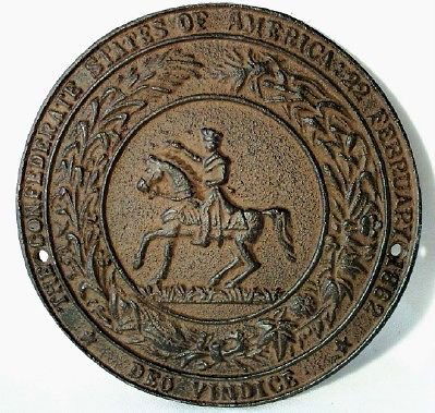 1862 CAST IRON CSA SOUTHERN PLAQUE: Great Seal Of The Confederacy plaque. The plaque measures 7 inches in diameter and has two holes for mounting. The plaque reads "The Confederate States of America 22 February 1862 Deo Vindice". Heavy