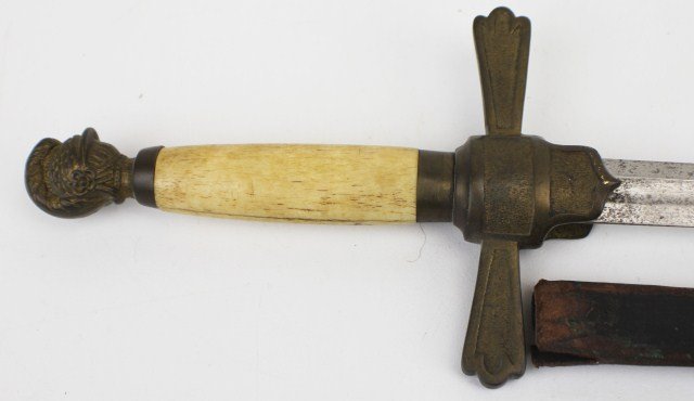 CIVIL WAR ERA MILITIA OFFICERS SWORD: CIVIL WAR ERA MILITIA OFFICERS SWORD Militia Officer's Sword, 26in double edged blade, with brass knight's head pommel and cross guard. Bone grip. Leather scabbard