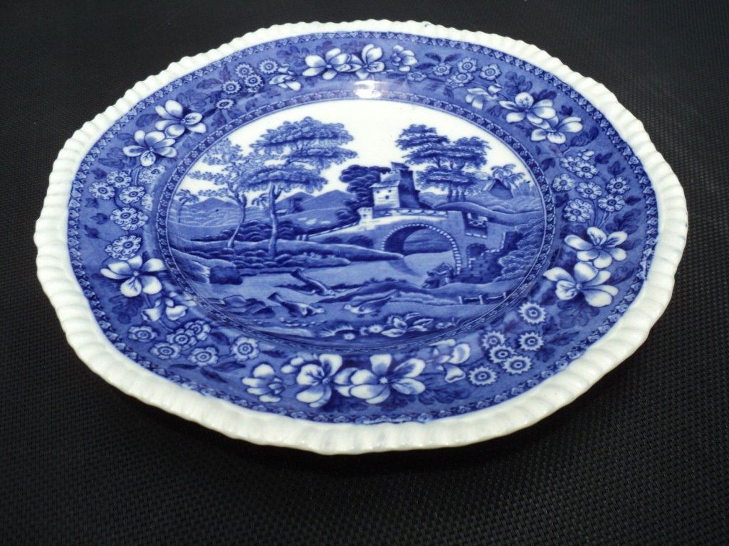 Copeland “Flow Blue” 10 1/2” Spode’s Tower Plate: Copeland “Flow Blue” 10 1/2” Spode’s Tower. Lovely countryside scene with medieval castles, forests, intertwined with floral patterns. Beautiful deep contrasting colors. A favorite depiction,