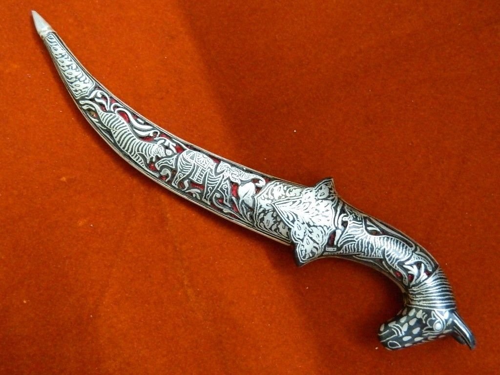 Indo Persian Rajput Hunting Dagger, Damascus Blade: Indo Persian Rajput Hunting Dagger, Damascus Blade. Silver work. Curved blade. Silver Koftgari Work Indian Dagger. 10".