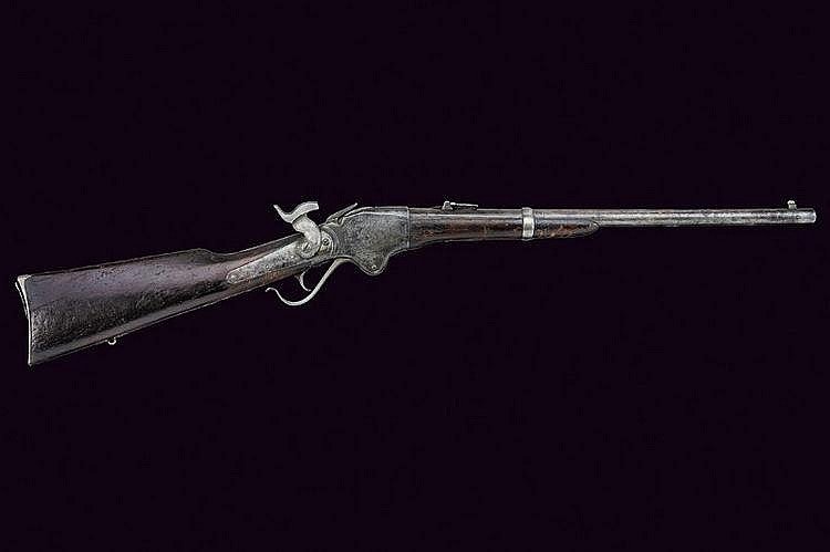 Spencer repeating Carbine Round, rifled, 12 mm cal: A Spencer repeating Carbine Round, rifled, 12 mm cal. barrel, octagonal at the base with address, adjustable rear-sight and foresight; backward spring lock, lever, stiff hammer; wooden stock into two 