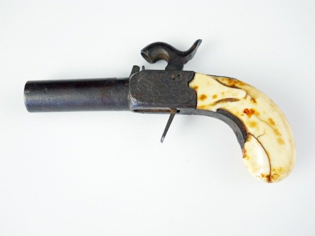 Early 19thc Ivory Gambler's Vest Pocket Pistol: Large .45 Caliber, twist of rifled Barrel. Carved Ivory Grip with surface cracks & discoloration with age ( easily cleaned ). Heavily engraved breach & drop down trigger housing traces of bright bluin