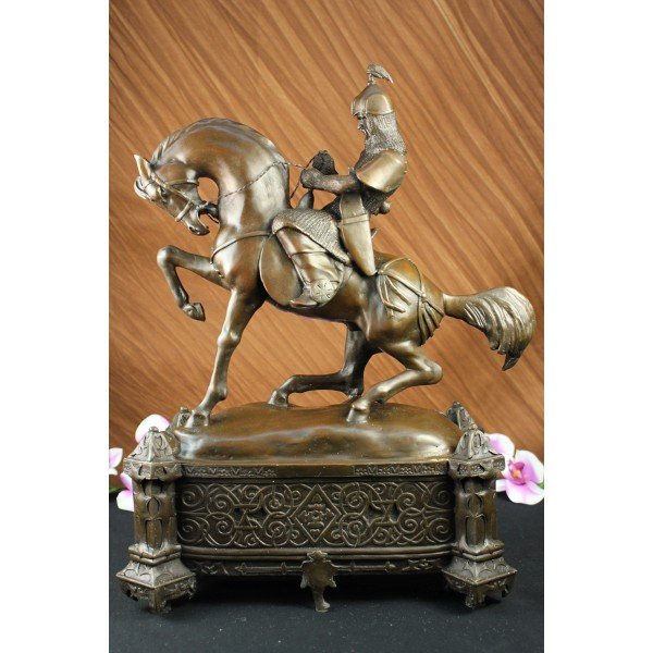 Victorian Bronze Mounted Knight Sculpture: Victorian style bronze knight in full armor mounted on his horse. Lost wax casting method bronze with brown patina atop elaborate decorative bronze footed plinth. 17"H X 15" W. 20lbs.