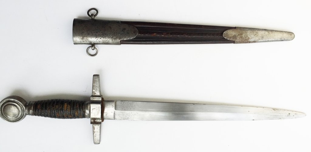Superb Condition Medieval Dagger: Knight's sidearm. Measures overall length 17". 10 1/2" double edged steel blade. Retains leather washer. Crusade style cross guard. 95% original leather on grip with 100% twisted iron wire remaining i