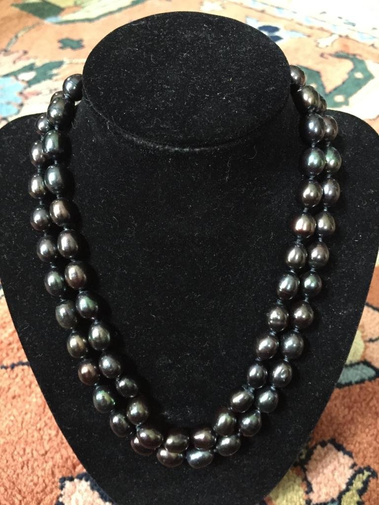 Black Tahitian Baroque Pearl Necklace: Double strand of 11 - 13mm black baroque shaped Tahitian pearls. 18" necklace with white baroque pearl silver plated clasp.