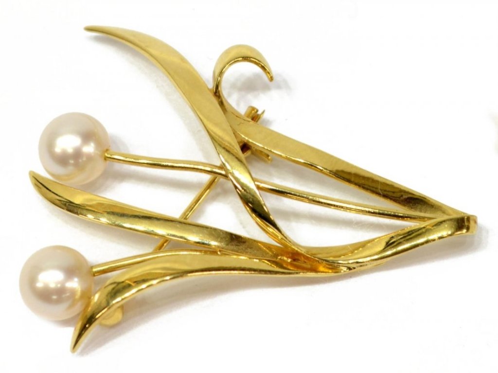 Vintage Estate Mikimoto Pearl 14kt Gold Brooch: Brooch executed in 14kt gold. Pin in foliate motif, having two pearls, approx 6.64mm each, 1 1/2" L X 1 1/4" W. Hall marked "M", K 14". Provenance : from the San Diego, California estate of a Dr. & hi
