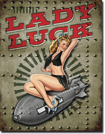 Lady Luck WWII Pin Up Sign: New, vintage-look metal advertising sign featuring the legendary WWII Lady Luck pin up girl sitting on a bomb - painted on the side of a WWII bomber plane. 12" X 17" with pre-drilled holes for hanging