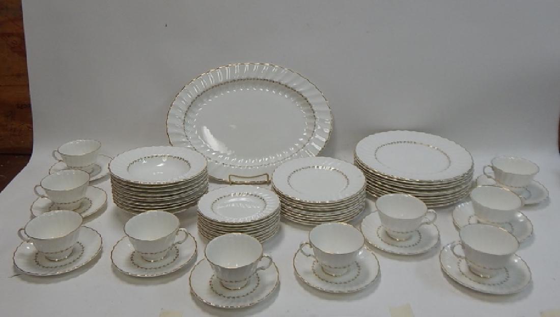 ADRIAN SET OF DISHES BY ROYAL DOULTON: SERVICE FOR 10. INCLUDES, 16" BY 12" PLATTER, 10 AND 1/2" DINNER PLATES, 8" SALAD PLATES AND SOUP BOWLS, 6" DESSERT PLATES, ALONG WITH TEA CUPS AND SAUCERS. FEW MINOR CHIPS