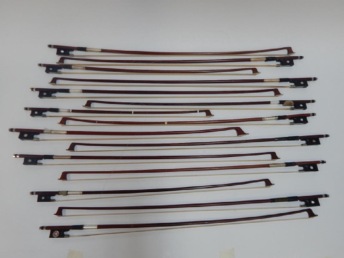 FIFTEEN VIOLIN BOWS: SOME STRINGS ARE LOOSE. SIZES RANGE FROM 20" TO 29"