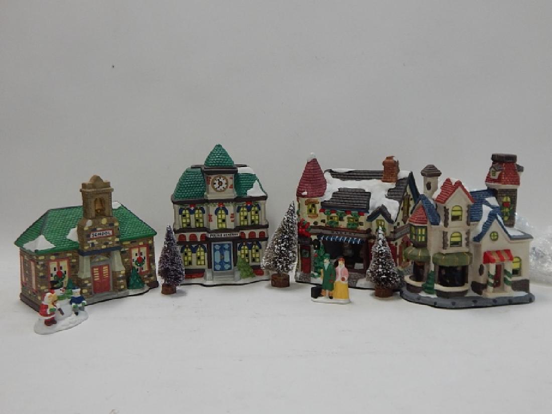 COLLECTION OF PORCELAIN VILLAGE BUILDINGS: COLLECTION OF PORCELAIN VILLAGE BUILDINGS WITH FIGURES, TREES AND MORE.