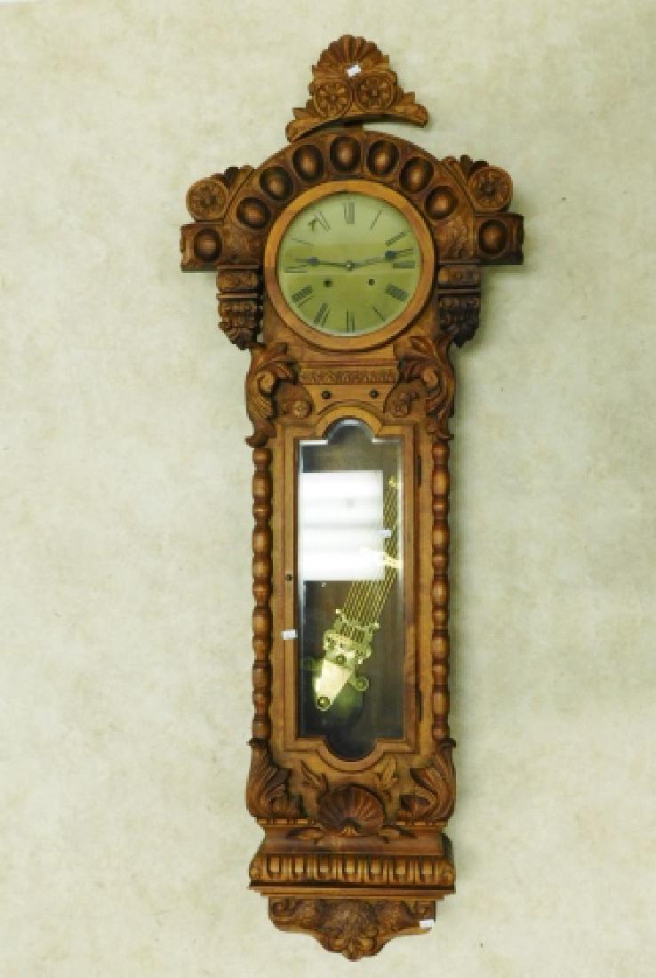 WALL CLOCK: MINOR CHIPS. WITH KEY AND PENDULUM. 56" TALL WORKS OF CLOCK ARE AS IS not a old clock