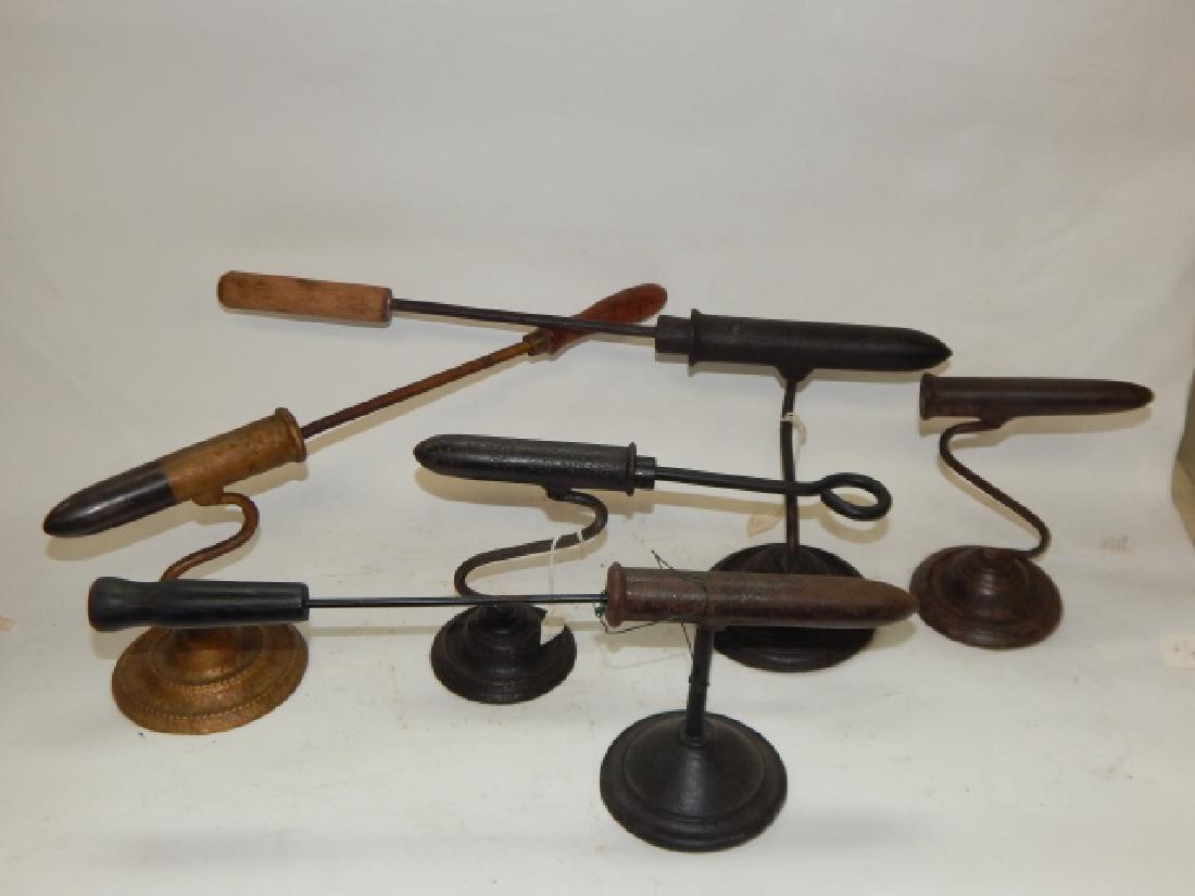 CUFF IRONS WITH STANDS: LARGEST IS 6 1/2" BY 18 1/2", SMALLEST IS 6 1/2" WITHOUT ROD, RARE FIND FROM SOUTH SIDE ESTATE