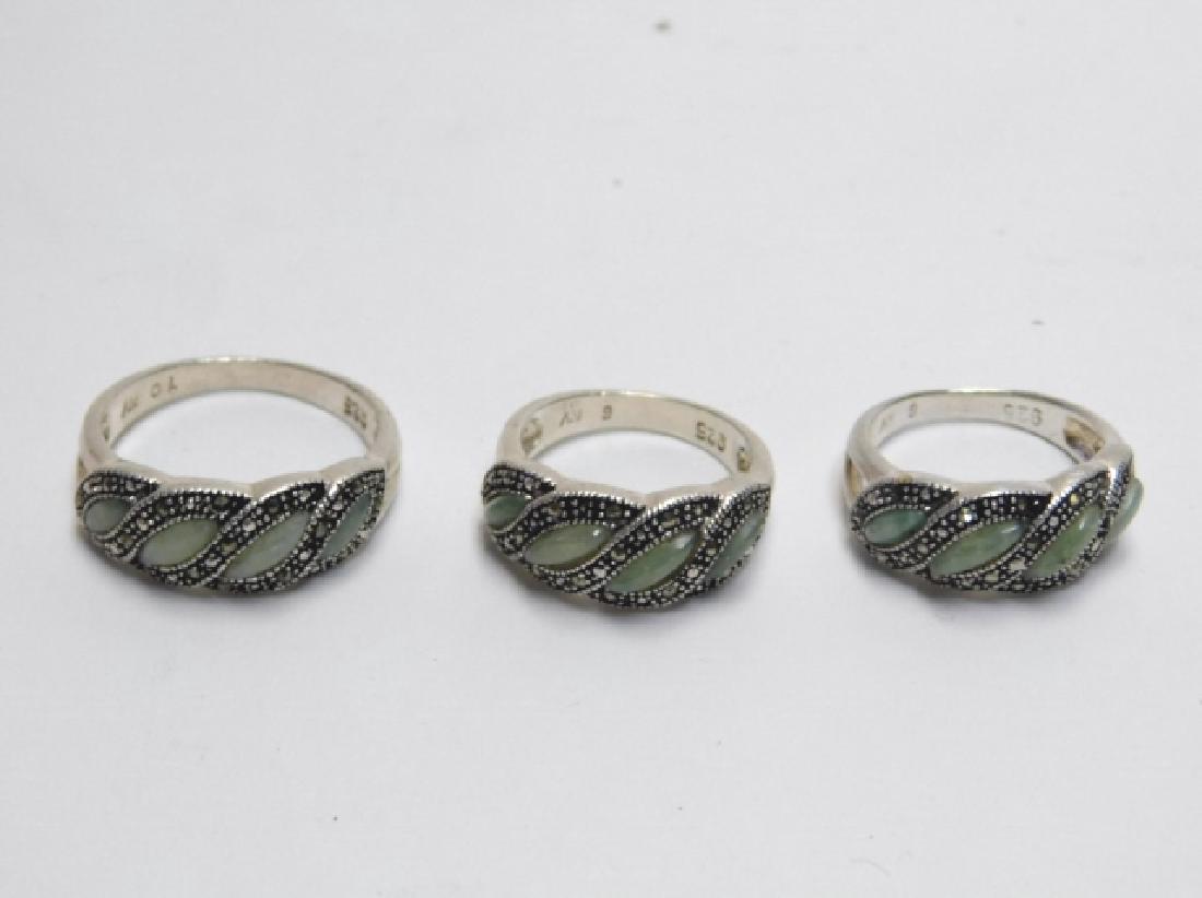 THREE STERLING SILVER RINGS WITH MARCASITE: CELEDON GREEN STONES. 0.5OZ
