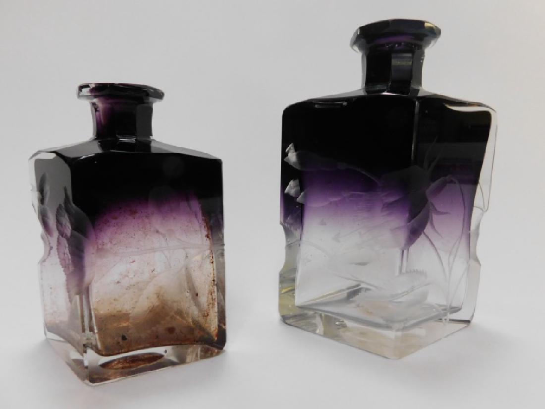 TWO AMETHYST HARRACH INTAGLIO PERFUME BOTTLES: LARGE ONE HAS WRONG TOP, BOTH STOPPERS ARE AS IS.. OVERALL GOOD CONDITION, JUST NEEDS A LITTLE CLEANING. TALLEST IS 5 1/2"