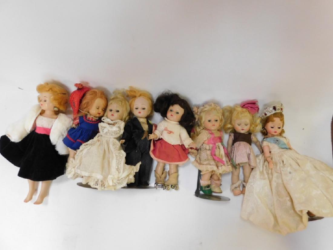 LARGE LOT OF DOLLS: SMALL DOLLS, SOME ON STANDS. ONE WITH ROLLER SKATES JENNY DOLLS