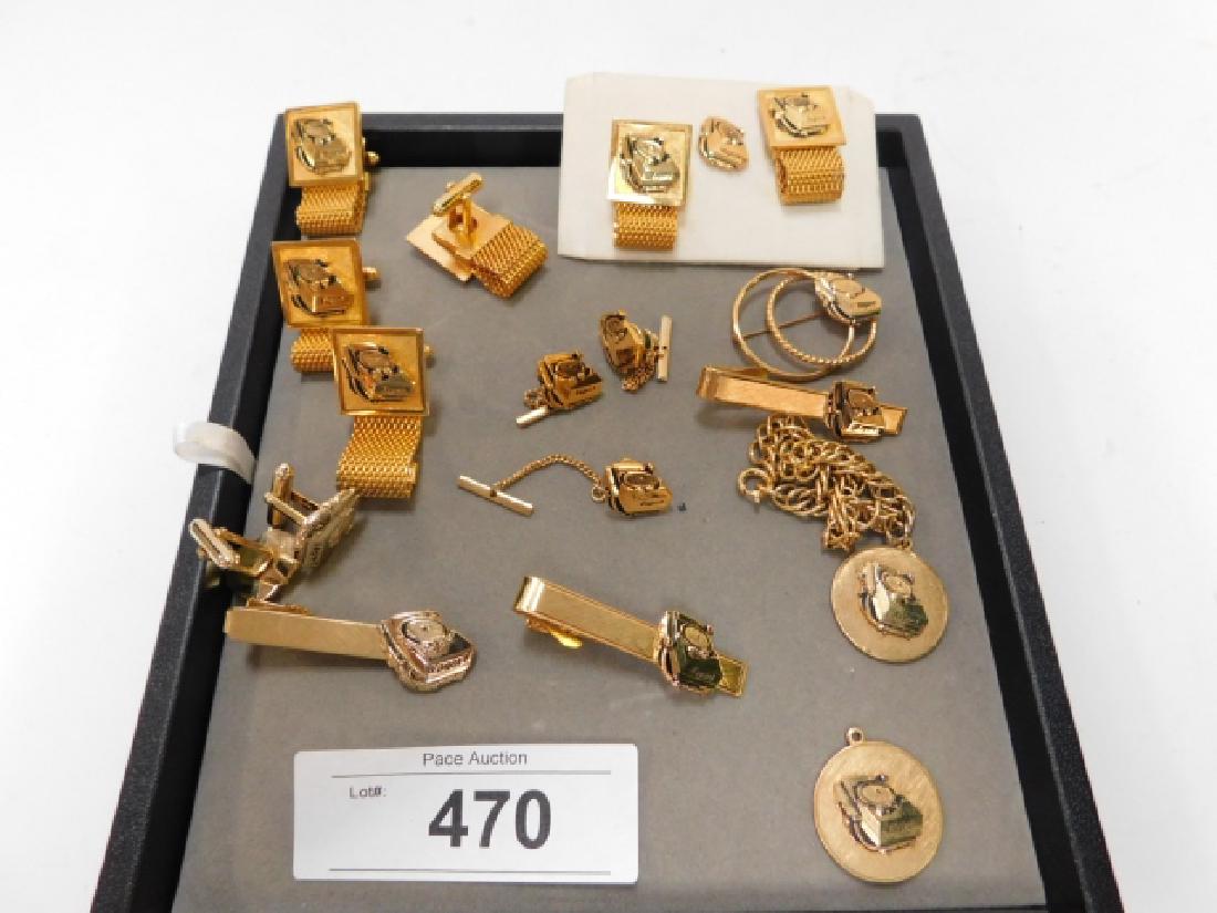 EAGER-1 MILITARY PHONE CUFFLINKS & TIE CLIPS: LARGE LOT OF EAGER-1 MILITARY COMMUNICATIONS PHONE RADIO TIE CLIPS AND CUFFLINKS WITH GOLD TONE. ALSO INCLUDES ONE BRACELET. GREAT LOT FOR ANY COLLECTOR!