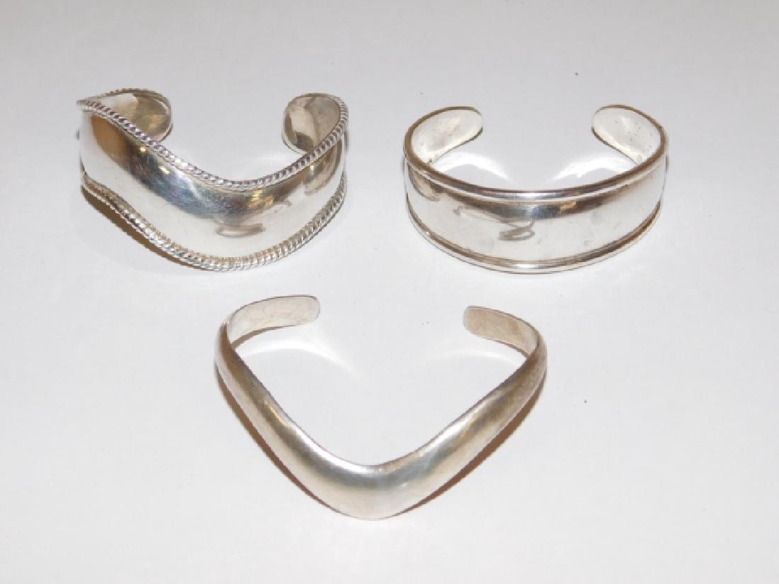 THREE STERLING SILVER CUFF BRACELETS: ONE IS MEXICAN SILVER. 2.5OZ