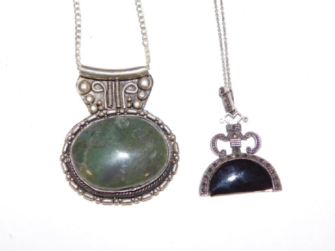 TWO STERLING SILVER PENDANTS ON CHAINS (1 of 2)