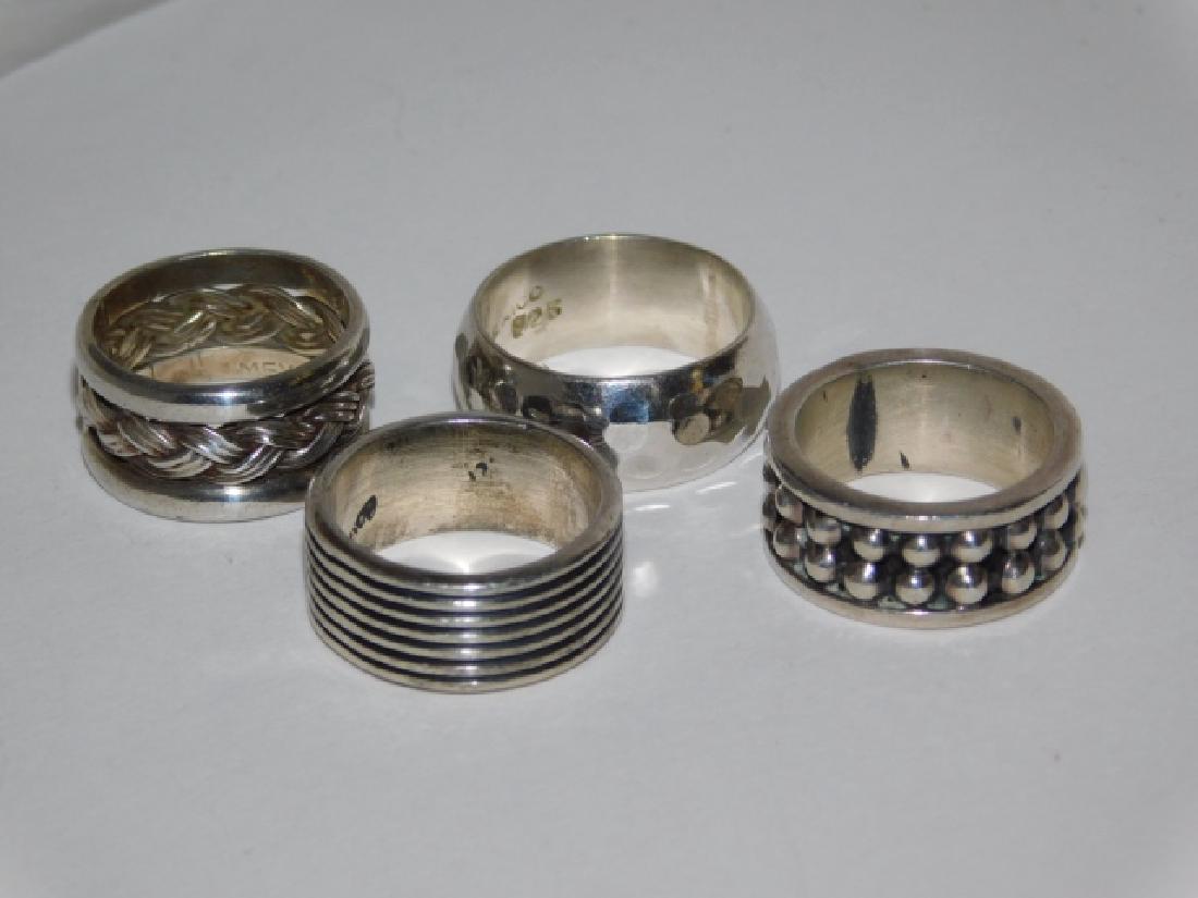 FOUR STERLING SILVER RINGS: 1.0OZ. FOUR MAGNIFICENT RINGS WITH INTRICATE DESIGNS, SIZES 7-9. TWO MARKED MEXICO.