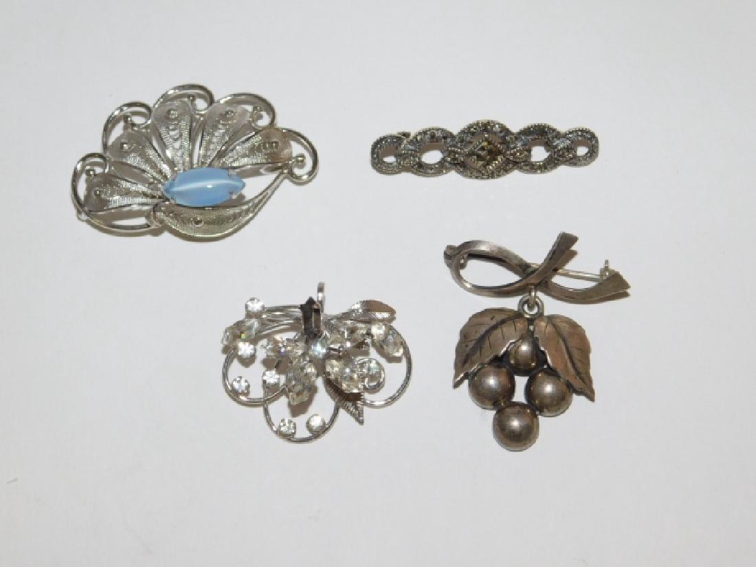 FOUR STERLING SILVER BROOCHES (1 of 2)