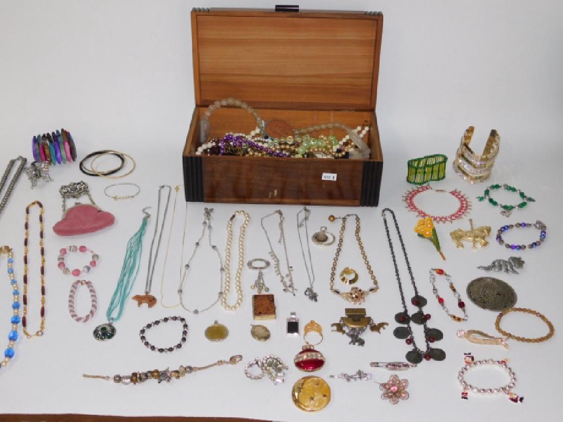 COLLECTION OF COSTUME JEWELRY WITH BOX: CHANGE PURSE, RHINESTONE BUTTERFLY HAIR CLIP, CHARM BRACELET HAS BROKEN CLASP WITH IS FULL OF GREAT CHARMS. BEADED NECKLACES AND ANKLETS, LARGE CUFF BRACELET, ALSO WITH PINS, PENDANTS, AND SO MUCH MOR
