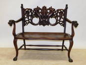 HEAVILY CARVED OAK BENCH